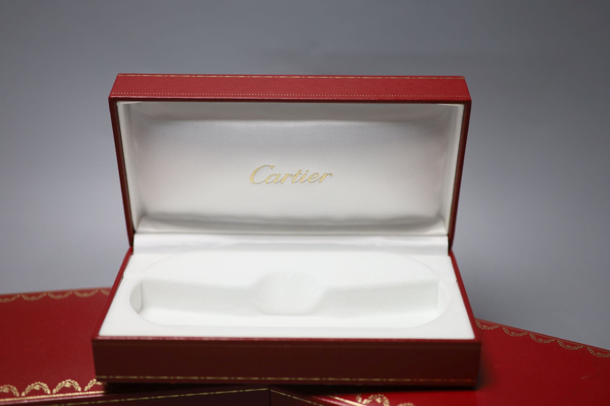 Three modern Cartier fitted jewellery boxes and one other Cartier box.